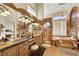 Elaborate bathroom with dual vanities, jetted tub, separate shower, and ornate marble-style decor at 2909 Sterling Cove Dr, Las Vegas, NV 89128