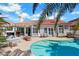 Backyard pool, seating, spa and covered patio area at 2909 Sterling Cove Dr, Las Vegas, NV 89128
