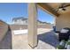 The back patio has a ceiling fan, a lounge chair and a view of the backyard at 2951 Overlook Brook St, Las Vegas, NV 89156