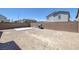 A backyard view with a concrete pad and a brick wall surrounding the property at 2951 Overlook Brook St, Las Vegas, NV 89156