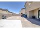 The backyard is spacious and includes a concrete pad and a barbecue at 2951 Overlook Brook St, Las Vegas, NV 89156