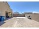 A view of the backyard, with a patio, concrete pad, barbecue and privacy wall at 2951 Overlook Brook St, Las Vegas, NV 89156