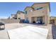 The backyard is spacious and includes a concrete pad and a barbecue at 2951 Overlook Brook St, Las Vegas, NV 89156