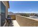 This balcony area offers a comfortable seating area with neighborhood views at 2951 Overlook Brook St, Las Vegas, NV 89156