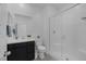 Bathroom with a glass enclosed shower, black vanity, white countertops, and a large mirror at 2951 Overlook Brook St, Las Vegas, NV 89156