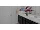 Bathroom with dual vanity, white countertop, and modern faucets at 2951 Overlook Brook St, Las Vegas, NV 89156