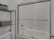 Bathroom features a tub and shower combination with sliding glass door at 2951 Overlook Brook St, Las Vegas, NV 89156