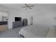 Bedroom with gray walls, carpet, a ceiling fan, and lots of natural light at 2951 Overlook Brook St, Las Vegas, NV 89156