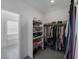 Walk in closet featuring shelving and hanging rods for clothing and storage with a bathroom view at 2951 Overlook Brook St, Las Vegas, NV 89156
