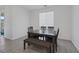A bright dining room with a table, seating and sliding door access to the patio area at 2951 Overlook Brook St, Las Vegas, NV 89156