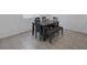 The dining room features a table with seating for six, and a window providing natural light at 2951 Overlook Brook St, Las Vegas, NV 89156