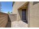 Exterior shot showing a side entrance with brick pavers and textured wall at 2951 Overlook Brook St, Las Vegas, NV 89156