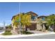 Attractive two-story home with low maintenance landscaping and a two-car garage on a sunny day at 2951 Overlook Brook St, Las Vegas, NV 89156