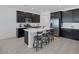 A spacious kitchen features a central island with bar stool seating and modern stainless steel appliances at 2951 Overlook Brook St, Las Vegas, NV 89156