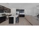Bright modern kitchen with stainless steel appliances, quartz countertops, and an island with seating at 2951 Overlook Brook St, Las Vegas, NV 89156