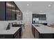 Bright modern kitchen boasts stainless steel appliances, stone countertops and an island at 2951 Overlook Brook St, Las Vegas, NV 89156