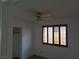 Bedroom with a ceiling fan, shuttered window, and closet at 3024 Nutwood St, Las Vegas, NV 89108