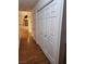 Hallway with closet doors and hardwood floors at 3024 Nutwood St, Las Vegas, NV 89108