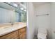Simple bathroom with modern sink, large mirror, and a toilet at 3111 Bel Air Dr # 18B, Las Vegas, NV 89109