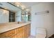 Bathroom features an expansive vanity and mirror and a glass enclosed shower at 3111 Bel Air Dr # 18B, Las Vegas, NV 89109