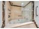Elegant bathroom features a glass enclosed tub and shower with marble accents at 3111 Bel Air Dr # 18B, Las Vegas, NV 89109