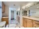 Bathroom featuring modern toilet, cabinets and a large mirror at 3111 Bel Air Dr # 18B, Las Vegas, NV 89109