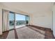 Bright bedroom with sliding glass doors leading to a private balcony and city views at 3111 Bel Air Dr # 18B, Las Vegas, NV 89109