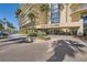 Regency Towers building entrance with manicured landscaping and easy circular access at 3111 Bel Air Dr # 18B, Las Vegas, NV 89109