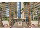 Beautiful building exterior surrounded by palm trees with grand entryway at 3111 Bel Air Dr # 18B, Las Vegas, NV 89109