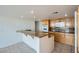 Spacious kitchen island with granite countertop and pendant lighting at 3111 Bel Air Dr # 18B, Las Vegas, NV 89109
