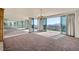 Bright living room with balcony access and mirrored wall enhancing natural light at 3111 Bel Air Dr # 18B, Las Vegas, NV 89109