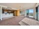 Open living space flows to the kitchen and features balcony access with city views at 3111 Bel Air Dr # 18B, Las Vegas, NV 89109