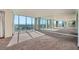 Spacious living room with floor-to-ceiling windows providing panoramic city views at 3111 Bel Air Dr # 18B, Las Vegas, NV 89109