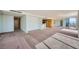 Open living room with floor to ceiling windows and sliding doors to the balcony at 3111 Bel Air Dr # 18B, Las Vegas, NV 89109