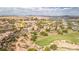 Community aerial view showcasing lush landscaping, elegant homes, and the scenic golf course at 32 Cerchio Basso, Henderson, NV 89011