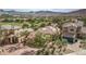 This beautiful property is located near a golf course and features mature landscaping, adding to its curb appeal at 32 Cerchio Basso, Henderson, NV 89011