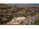 Luxurious home boasts lush landscaping, tile roof, large windows, and manicured yard in a great neighborhood at 32 Cerchio Basso, Henderson, NV 89011