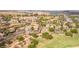 Expansive aerial shot highlighting the community's landscaping, elegant homes, and scenic golf course views at 32 Cerchio Basso, Henderson, NV 89011