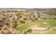 Community aerial view showcases lush landscaping, elegant homes, and the scenic golf course at 32 Cerchio Basso, Henderson, NV 89011