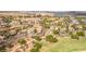 Community aerial view showcases lush landscaping, elegant homes, and the scenic golf course at 32 Cerchio Basso, Henderson, NV 89011
