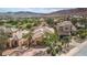 An aerial shot showcasing the property's prime location on a lush green golf course with stunning mountain views at 32 Cerchio Basso, Henderson, NV 89011