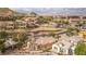 Gorgeous home boasts lush landscaping, tile roof, large windows, and manicured yard in a luxurious neighborhood at 32 Cerchio Basso, Henderson, NV 89011