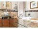 The luxurious bathroom has a large bathtub, a vessel sink, and designer details throughout at 32 Cerchio Basso, Henderson, NV 89011