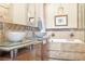 Beautiful bathroom featuring double sinks, granite counters, soaking tub and shower at 32 Cerchio Basso, Henderson, NV 89011