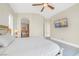 Bedroom features an ensuite bathroom, TV, and modern ceiling fan at 32 Cerchio Basso, Henderson, NV 89011