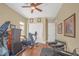 Bonus room with exercise equipment, a ceiling fan, and wood floors at 32 Cerchio Basso, Henderson, NV 89011
