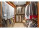 Spacious walk-in closet with custom shelving and ample storage for clothing and accessories at 32 Cerchio Basso, Henderson, NV 89011