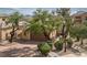 Beautiful single-story home featuring a well-maintained front yard with mature landscaping and a two-car garage at 32 Cerchio Basso, Henderson, NV 89011