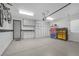 Organized garage with epoxy flooring, storage cabinets, and tool storage at 32 Cerchio Basso, Henderson, NV 89011