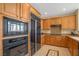 Functional kitchen with wooden cabinets, modern appliances, and granite countertops at 32 Cerchio Basso, Henderson, NV 89011